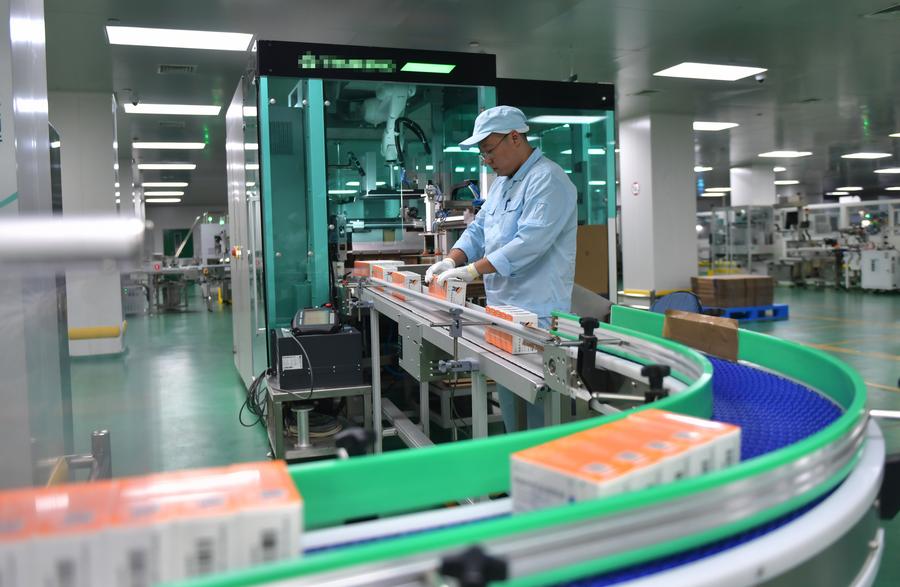 A worker checks medicines at Shenyang Sinqi Pharmaceutical Co., Ltd. in Shenyang, northeast China A worker checks medicines at Shenyang Sinqi Pharmaceutical Co., Ltd. in Shenyang, northeast China